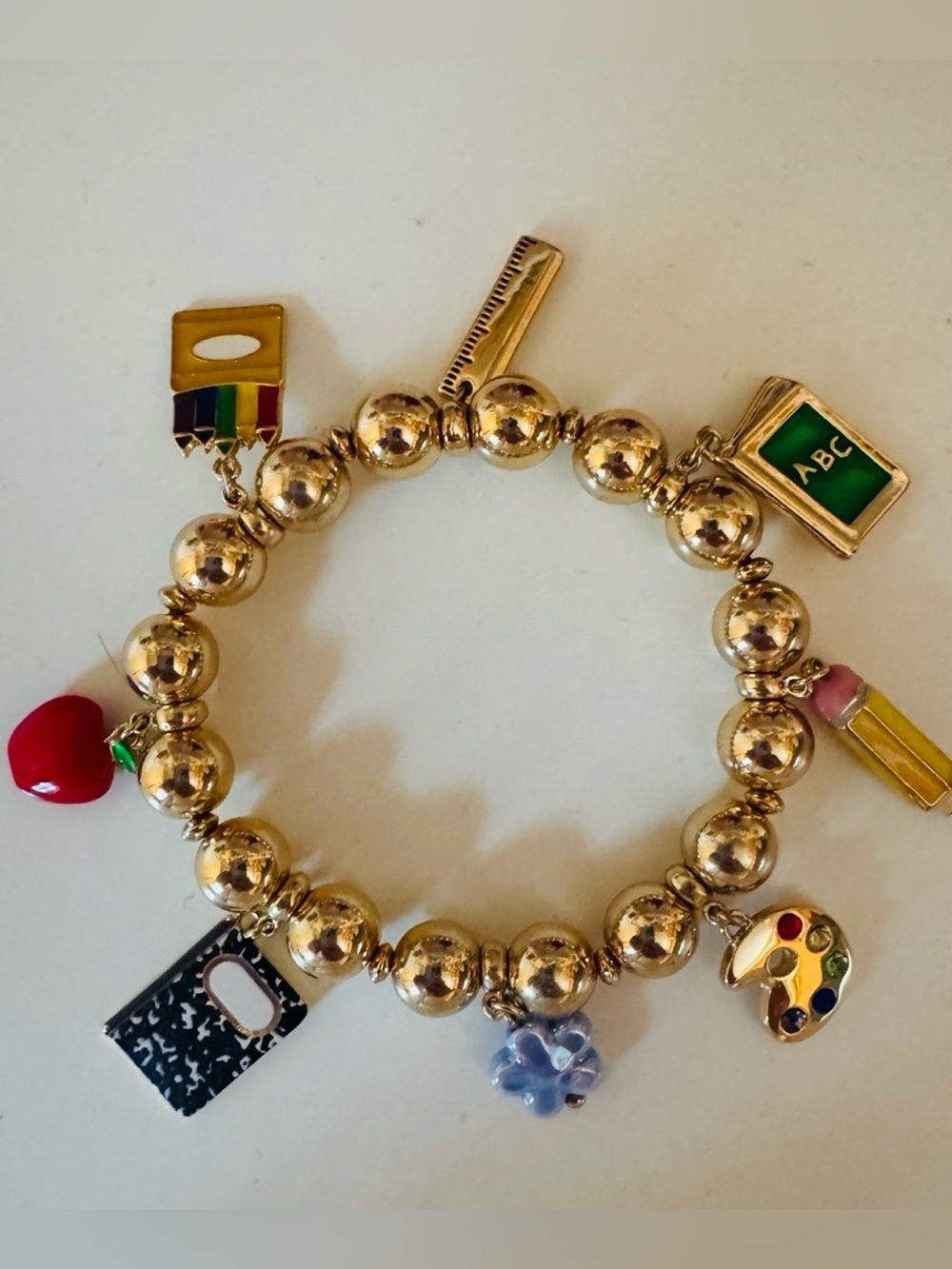 Betsey Johnson school teacher charm bracelet. Gold plated school teacher charm.